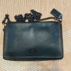 Black and brown coach cross over bag